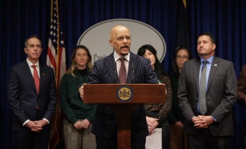 Pennsylvania Sen. Vincent Hughes speaks at a podium about cellphone-free schools